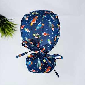 Rocket Ponytail scrub cap by ParadiseCaps. Space Surgical cap for women with satin lined option.