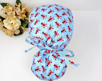 Lobster ponytail scrub cap women. Satin Lined option Ponytail scrub hat. Crawfish Scrub caps for women by Paradise Caps.