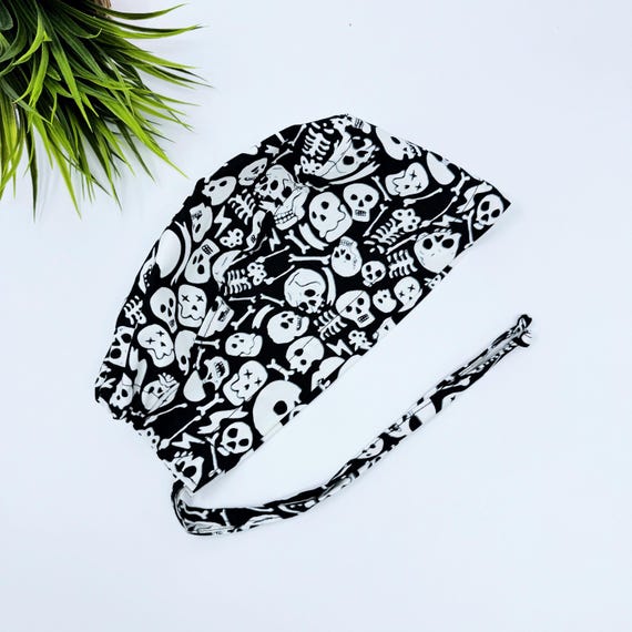 Glow Halloween Men's surgical cap. Skeleton Skull tie-back style scrub cap by Paradise Caps. Glow Tossed Skull-print