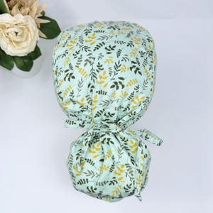 Leaves Ponytail scrub cap for women. Satin Lined Option Surgical cap with ponytail by Paradise Caps.