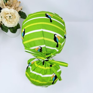 Toucan ponytail scrub cap for women. Summer Ponytail scrub hat, Scrub caps for women by Paradise Caps.