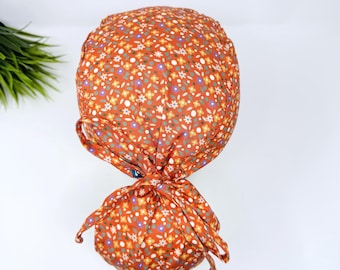 Ponytail scrub cap for women. Ditsy Flower Scrub hat for women with satin lined option by Paradise Caps.