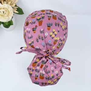 Plant Ponytail scrub cap women. Floral Satin Lined Option Surgical cap with ponytail by Paradise Caps.