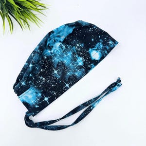 Space Men&#39;s Scrub Cap. Galactic skull tie-back style scrub cap by Paradise Caps.