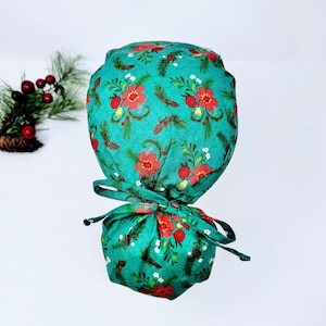 Christmas Ponytail scrub cap with Satin Lined. Poinsettias surgical scrub hats for women by Paradise Caps. Winter surgical scrub caps. Green