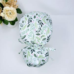 Floral Ponytail scrub cap for women. Ponytail Surgical cap with satin lined option by Paradise Caps.
