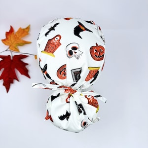 Halloween Ponytail scrub cap for women. Surgical hat with satin lined option by Paradise Caps.