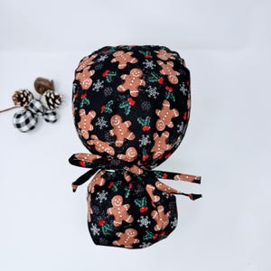 Gingerbread Men ponytail scrub cap for women. Christmas surgical hat with satin lined by Paradise Caps.