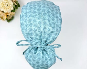Floral Ponytail scrub cap for women. Pink Scrub hat for women with satin lined option by Paradise Caps.