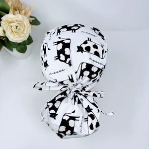 Cow ponytail scrub cap with satin lined option. Funny Surgical cap for women by Paradise Caps.