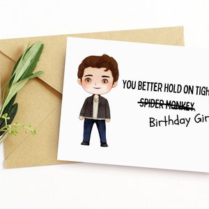 May include: A greeting card with a cartoon illustration of a man. The card reads "You better hold on tight, Birthday Girl".