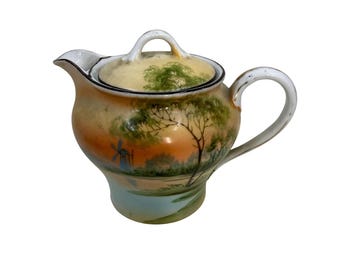 Jarra de crema de porcelana Nippon pintada a mano con tapa y diseño de molino de viento.