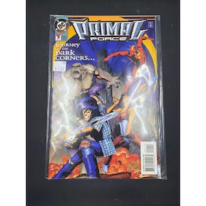 May include: A comic book titled "Primal Force" with a colourful cover featuring action illustrations. The cover includes the text "Journey to the Dark Corners..." and the DC Comics logo. The comic is sealed in a protective plastic sleeve.