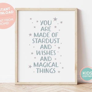 May include: A printable wall art print with a light blue background and white text that reads "You are made of stardust and wishes and magical things". The text is surrounded by small white stars.