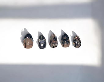 Black and Silver Press on Nails with Chrome Lace Charms that are Bows, Rhinestones, and a Iridescent Butterfly
