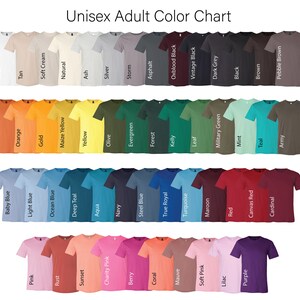 May include: Color chart showing a variety of t-shirt colors, including white, tan, soft cream, natural, ash, silver, storm, asphalt, oxblood black, vintage black, dark grey, black, brown, pebble brown, army, burnt orange, orange, gold, maize yellow, yellow, olive, evergreen, forest, kelly, leaf, military green, mint, teal, baby blue, light blue, ocean blue, deep teal, aqua, navy, steel blue, true royal, turquoise, maroon, red, canvas red, cardinal, pink, rust, sunset, charity pink, berry, coral, mauve, soft pink, lilac, purple.