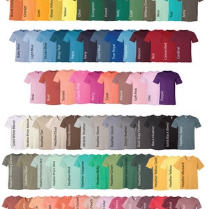 May include: Color chart showing a variety of t-shirt colors, including white, black, red, blue, green, yellow, and brown. The chart is organized by color family, with each color represented by a t-shirt.