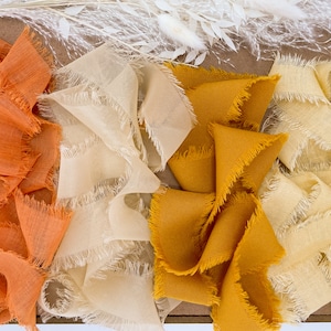 Handgerafeld oranje en neutraal lint