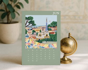 Pode incluir: Uma página de calendário de mesa verde sálvia para o mês de junho com uma ilustração do Parque Güell em Barcelona, com os seus icónicos padrões de mosaico, edifícios coloridos e árvores, junto a uma grelha de datas e o texto JUN no topo.