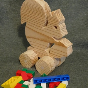 Wooden squirrel on wheels