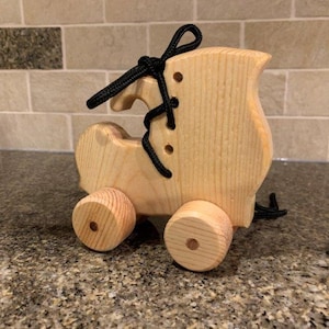 Wooden work boot on wheels