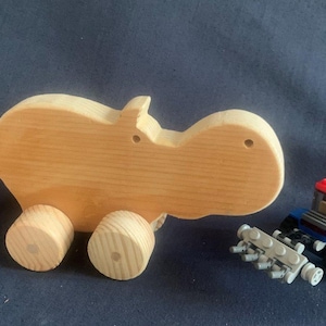 Wooden Hippo with cheese on wheels