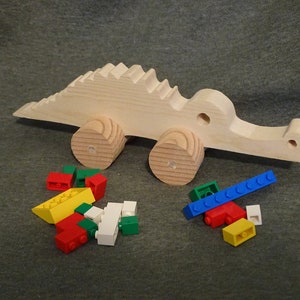 Wooden crocodile on wheels
