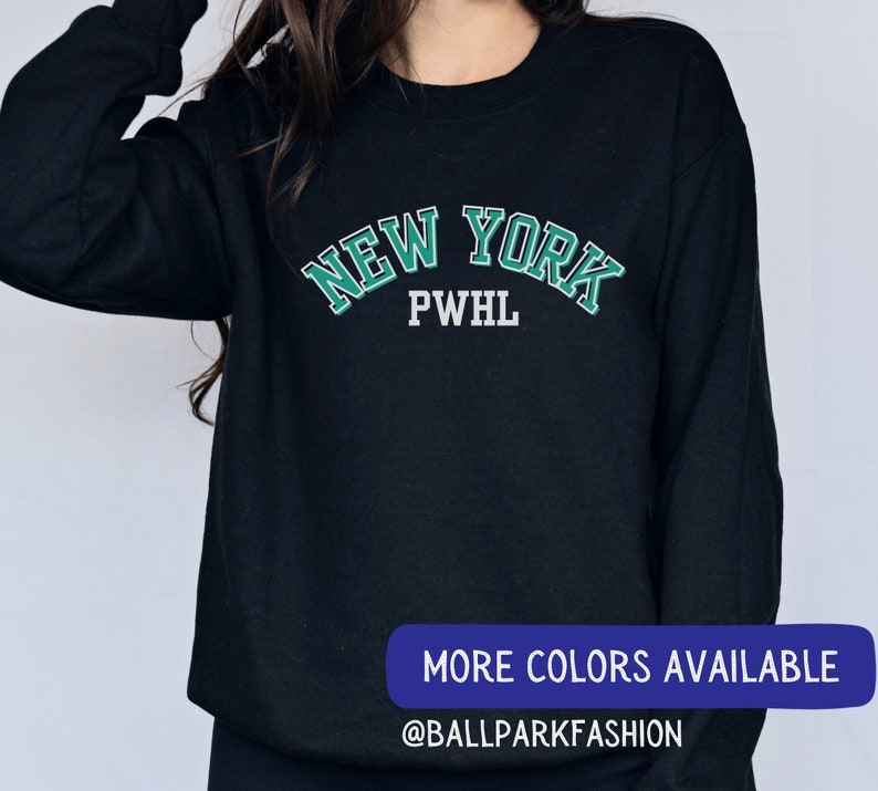 May include: Black sweatshirt with a green and white "NEW YORK PWHL" graphic.