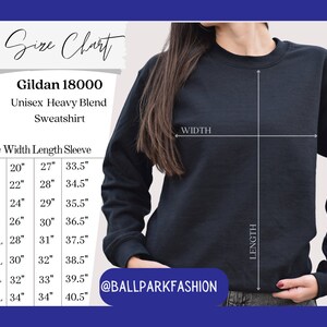 May include: Size chart for a Gildan 18000 unisex heavy blend sweatshirt. The chart shows measurements in inches for width, length, and sleeve length for sizes S through 5XL.