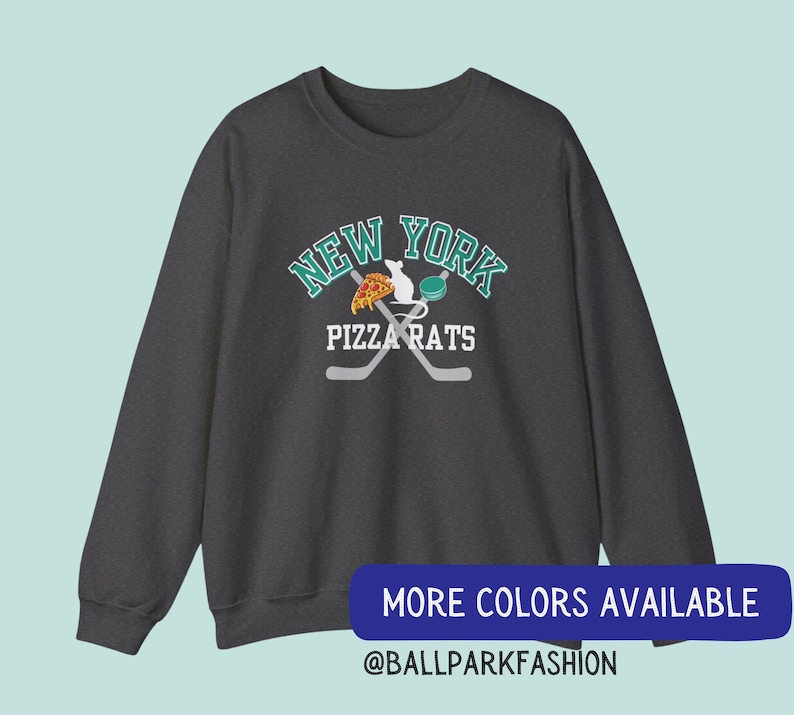 May include: Dark grey sweatshirt with a graphic of a rat eating pizza and holding a hockey stick. The graphic is surrounded by the text "New York Pizza Rats".