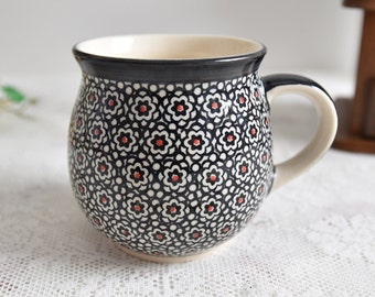 Handmade polish pottery mug with loop handle by Boleslawiec ceramic made in Poland with black flowers