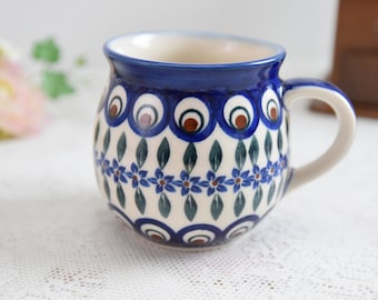 Polish pottery peacock tea mug with hand painted decoration made in Poland