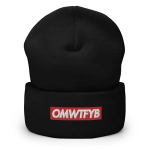 May include: Black beanie with a red patch that says "OMWTFYB" in white letters.