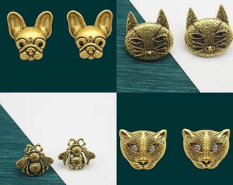 gold puma earrings