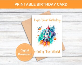 May include: Printable birthday card with a watercolor illustration of a rocket ship flying through space. The card says "Hope your birthday is out of this world".