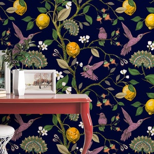 May include: A red table with a dark blue wallpaper featuring a repeating pattern of lemons, flowers, and hummingbirds. The wallpaper has a vintage aesthetic.