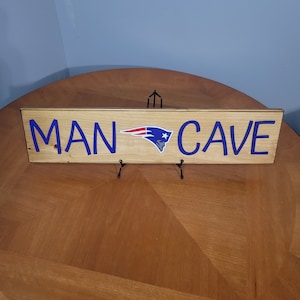 Panneaux suspendus personnalisés MAN CAVE. Equipes Nfl, Ncaa, Mlb, Nba disponibles