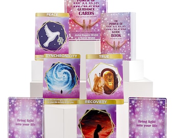 May include: A set of purple and gold oracle cards with images of a dove, a swirling galaxy, a cat and lion, and a woman standing in front of a sunset. The cards are titled "Peace", "Synchronicity", "True", and "Recovery". The box for the cards is titled "The Power of Healing Guidance Cards".