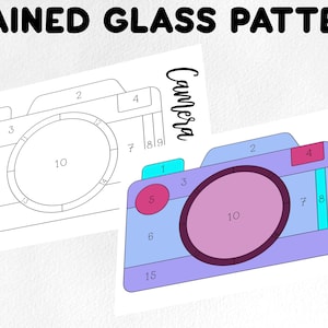 May include: A printable stained glass pattern of a camera with numbered sections. The pattern is in black and white, with the word "Camera" written in cursive at the top of the page. The pattern is ready to be colored in with different colors.