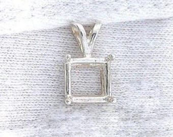 May include: A silver pendant setting with a square frame and a V-shaped bail. The setting has small ball accents at each corner of the square. The pendant is designed to hold a gemstone.