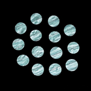 May include: A collection of 12 teal blue round stickers with the text "Ave Gemstones" repeated on each sticker.