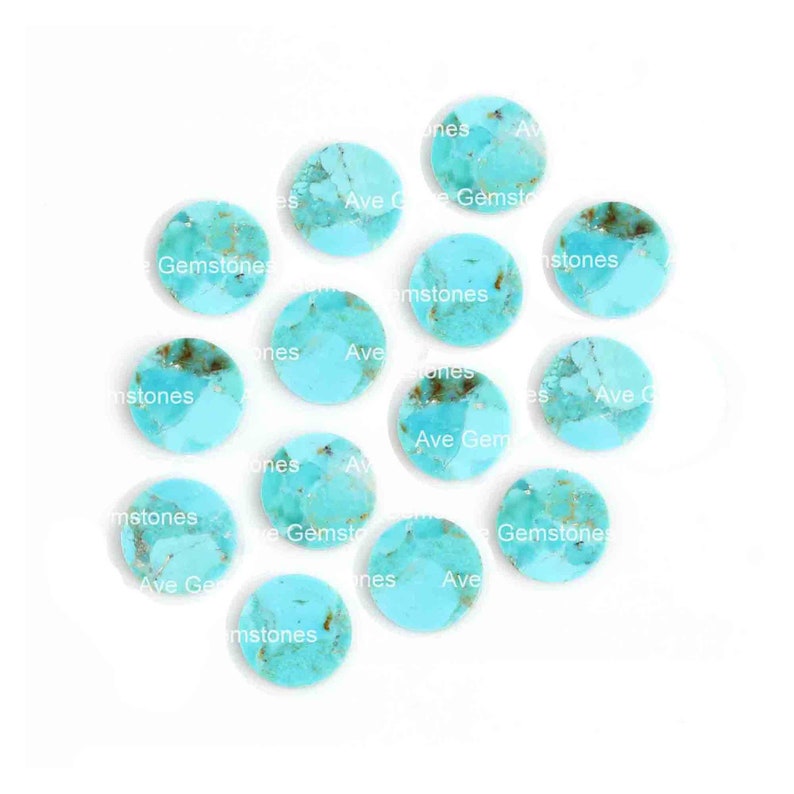 May include: A collection of 14 round turquoise cabochons, each with a unique pattern of blue and brown. The stones are approximately 1 inch in diameter.