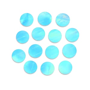 May include: A selection of circular, pale blue gemstones with an iridescent finish. The gemstones are arranged on a white backdrop. Each stone has the text "Ave Gemstones" printed on it.