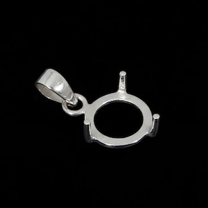 May include: A silver pendant setting with a circular design, featuring prongs for securing a gemstone. The pendant has a loop for a chain and is set against a black background. This jewelry component is designed for custom jewelry making.