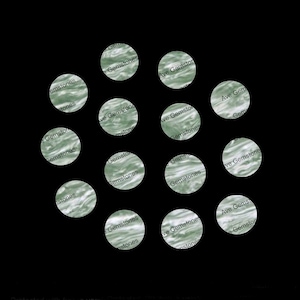 May include: A collection of 13 green and white patterned circles with the text "Ave Gemstones" repeated on each circle.