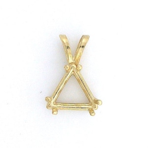 May include: A gold-colored pendant setting with a triangular design. The pendant has a V-shaped top and a triangle-shaped base with small, round accents at each corner. The setting is designed to hold a gemstone.