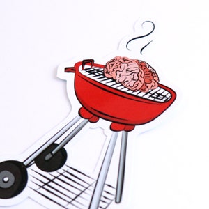 May include: A red and silver grill with a brain on the grill grate. There is steam coming from the grill.