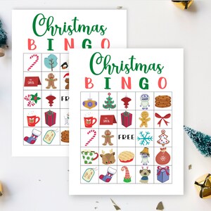 May include: Two printable Christmas Bingo cards with a festive red, green, and white color scheme. Each card has a 5x5 grid with images of Christmas-themed items like a snowman, gingerbread man, candy cane, and a stocking.