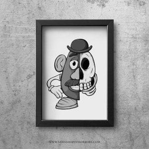 May include: Black and white illustration of a cartoon potato head with a skull on one side of its face and a regular potato head face on the other side. The potato head is wearing a hat.