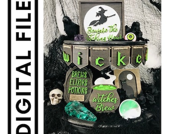 May include: A tiered tray decorated for Halloween with a black raven, a skull, green and black crystals, a cauldron, a black cat, and a banner that reads "wicked".